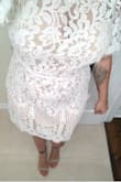 I read the customer reviews and decided to go with a Large - primarily because of my larger bust. After trying it on, I realized I realistically could have gone with a Medium and it would have fit well / snug - but I actually am glad I went with the Large because it gives it a bit of a more flowy feel!

The lace pattern is beautiful and my fiancé absolutely loves it - both of our favorite features are the sleeves with the subtle lace fringe. 

I plan to wear this for our wedding rehearsal dinner this Fall, but with how much I love it - I may end up wearing it again on our honeymoon as well! - Shawday B.