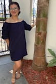 I'm in love with this dress. Be mindful the dress is loose fitted. I order an XS and is perfect. Thick material and the sleeves don't look puffy at all, love the pockets. - Jennifer S.