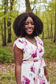 I just graduated with my MBA but because of the virus I had to celebrate from home. My brother was kind enough to give me a grad photoshoot so I ordered this dress. I started with a Medium since most of the Lulu's mediums fit me perfectly, but in this case it was too tight, mainly because the cleavage was so wide.  It showed off way more than what I was going for so I went up a size so I could alter it a bit. The Large was perfect, and the dress was perfect as well! I only knocked off one star because of the cleavage. Even if I was going for more cleavage it would've been WAY too much. - Sarah T.