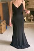 I received the Infinite Glory dress instead of the Melora, but the only difference is that the straps are thinner and the back is scooped instead of a V shape. I loved the dress enough to keep it, however! I usually wear a small, but I'm glad I went down a size like most of the other reviews suggested. FITS LIKE A DREAM. - Samantha N.