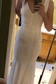 I ordered this dress originally as a second best, due to the one I really wanted not being in stock. Right afterwards, the dress I wanted came back and I knew I would be sending this one back...I was absolutely not expecting to fall in love with this dress like I did. I ordered an XS, and it fit like a dream! The bottom and the back are absolutely stunning. I am getting married in August and this is the dress! I will upload more photos after the wedding. - Katie N.