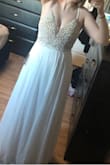 Due to the covid situation I'm unable to get my wedding dress altered. I ordered this dress to wear on my wedding day. I absolutely love it! So pretty and elegant. I read a lot of the reviews on here and decided to order a size down and I'm really glad I did! I usually take a size 6 in dressed and the size 4 fit me like a glove. - Lacey W.