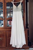 This dress is great! True to size, GREAT quality, well-worth the price! Since it's my wedding dress it needed a few alterations simply because of personal preference (too low-cut so I had the straps shortened, added a layer of tulle for a fuller skirt), but I wouldn't have changed anything about the material! The beading and tulle are high quality, not cheap or starchy. Lots of flow, beautiful shape, and it even looks great on my not so curvy figure! - Kim P.