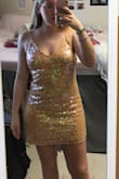 This dress is so fun and sparkly! I loved wearing it to my sorority semi formal event. I got tons of compliments and danced the night away in it! The back is also open and super fun. I didn't have a problem with the straps but my friends with less broad shoulders were worried it would fall off of them. - Gabby H.