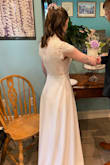 My now-husband and I had to postpone our wedding due to the coronavirus, but we opted to still get married on our original date. My original wedding dress wasn't going to be available for that date (alterations weren't done, and the boutique was closed), so I had to find a new and affordable dress. This was PERFECT for our day, I felt like a beautiful bride, and luckily it only needed minimal alterations (~6-8 inches hemmed off). It's a bit heavier than it looks, but by no means uncomfortable. It was actually very movable and flattering. Not a lot of give in the top half, but that was fine for me and this size. So happy with how the day went, and glad I opted for this gown! - Erin G.