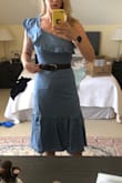 I'm typically a size M from Lulus, but after the reading the reviews, I got the small and it fits perfectly (it's not tight under the arm either). I really love it, and feel very feminine in it, but still can't quite decide if I like the one shoulder look or not - is it quirky or a bit nineties?! I've added a photo as I find them really useful, but note this is straight out of the bag, and very creased (and my room is a Lulus explosion!)! Looks much nicer when ironed. I've also added the belt. Oh, and it's lined! - Chloe D.