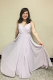 I definitely had to get this dress altered, if I bought it today I would probably get a medium, but it was so worth the money! Personally, I had to wear a strapless bra and heels. It flattered me at every angle and is such high quality! I wore it to an event at my college and it was a stunner. - Christine C.