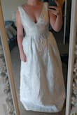 This dress looked exactly like the picture. It's pretty long, even for someone of average to above average height so maybe expect to make alterations if you aren't extra tall. The fabric is beautiful and comfortable with a soft lining and not see through at all. Very good quality purchase. - Victoria V.