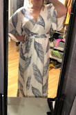 Loose and great cut for hiding problem areas. Going to wear it for my bridal shower :) I am wearing wedges in the photo because I am NOT tall. - Jamie D.