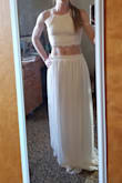 I wanted to love this piece but the skirt just didn't work. The top fit like a glove. The skirt sat way lower on me than the model, though. Showed too much skin to be appropriate for the occasion. Getting a smaller size in the skirt might have helped, but I didnt want to purchase two, so I returned. - Alicia P.
