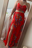 I've never been more in love with a dress. I bought this for a summer wedding that was unfortunately postponed which is why there isn't pics from that. Its very light material and the skirt is "wrap" style which gives you the freedom to adjust the size of the waist if needed. I really like that the slit isn't super apparent while your walking around but you can definitely pop out a knee for a pic and show it off. The length also isn't an issue for me (5'5") as long as I throw some heels on. 10/10 would recommend! - Caitlin M.
