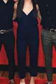 I love this jumpsuit! It's amazing quality and looks stunning. However, it fits me a little longer than I thought it would, and it fit me a little tight around the thigh area (although it's not a big enough "tightness" to make me change the size). - Juliana O.