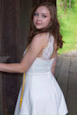 I was on a hunt for white dress for graduation that wasn't cheap quality and see-through. I found Lulus on Pinterest, and fell in love with this dress. The reviews said that this dress has a nice, thicker material, and they were right. The dress isn't see-through at all, and I can tell that it will last a long time. The dress is an off-white color, and it wasn't too tight or too loose, it fit perfectly. I did shorten the skirt of the dress because I'm really short and prefer my dresses/skirts to be a few inches about my knee. Before I altered it, the dress came right about my knee. Overall, I love this dress and will be buying from Lulus again in the future. - Kayla G.