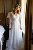 I absolutely love this dress!! It was perfect right out of the package for my height and arm length. The back lace detail is stunning and the fabric quality is impressive! I wore this for my elopement and received so many compliments! - Caroline K.