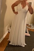 This dress is so pretty. My fiancé and I had a change of plans and are now eloping and my original dress would not work. Finding this dress is a lifesaver! I will need to get it taken in at the bust but overall this dress fits perfectly. I bought a large which is was I normally wear. Not too long or too tight. - Lesley F.