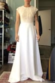 I was surprised by how heavy this dress was, great material, but far too much material for me. The lace is very pretty and the cap sleeves and neckline is a very elegant touch, but too frilly for me, ha. I tucked them in, making a more modern look. - Allison B.
