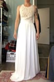 So I was really excited to try this dress on but I didn't like it like I thought I would. The bodice was ill-fitting in the bust, maybe if I were two inches taller or had a longer waist it would fit better, but it would be an easy alternation otherwise. The waist and back fit well though! The side insert is a nice touch and Depending on lighting the bodice could look white or nude. - Allison B.