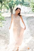 This dress is beautiful especially taking photos during the day since the sun shines through it. It was long on me even in 4 inch heels so I did have to hem it. It was an excellent engagement photo shoot dress! - Paddy M.