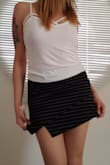 This is a must have skort, it goes with any color solid top, nice stretchy and thick fabric, feel very comfortable with the shorts underneath it. Bought "s" size with my sometimes 27 or 28 inch waist. Love itt!!! - Karla J.