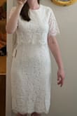 This dress is a little looser than pictured (especially in the sleeves) but the lace is pretty and it has a little stretch so it is very comfortable. It's also a good length which is sometimes hard to find since I'm taller. - Nicole H.