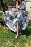 This dress is gorgeous!!! I love how flowy the skirt is and how beautiful the print looks. Can't wait to wear it for my engagement photos - Charlie B.
