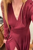 I ordered this a couple days after I got engaged. It arrived within 5 business days! I was a little skeptical about the V cut, but it looks SO flattering on! Just remember to wear the right bra that won't show in the middle, if you choose to wear a bra. It's so comfortable and a heavier, quality material. I know that I will wear this many more times! I steamed it to remove the wrinkles before I wore it for photos. All of my peers raved about the dress! My favorite part is the button detailing along the wrists. I loved it much more than I thought I would!!! Would definitely order again in a different color. Also, it fits true to size! - Kate T.