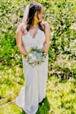 Decided to push up my wedding and have a very small ceremony in a park in. I ordered this dress and another and decided on this one because it's so beautiful! It actually looks a lot like a few wedding gowns I had saved for wedding inspo. It's super comfy and flowy! I had to have the front hemmed ever so slightly, I did wear wedges with a small heel. I have bigger boobs and they were a little squished but it's to be expected. This dress is low cut has no support because of the extremely flimsy and thin straps but if you find a good strapless bra it'll work for busty gals! I love this dress so much I felt so beautiful and confident in it. - Kelsey F.