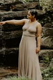 This dress fit perfectly because I ordered a size down. Its long and super stretchy but definitely get some pasties because anything your wear under it will show the lines. I wore it for our photoshoot and it was so comfy and flowy and I love that I can wear it in a different style. So worth it! - Sierra T.