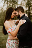 I wore this dress for my engagement photos while I was 20 weeks pregnant! It hid the bump very well and was SO pretty! The fit was perfect and was loose fitting around the waist area! Definitely would look good if you were trying to show off the baby bump too! - Kaitlyn K.