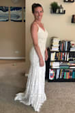 After trying on several Lulus styles, I chose this for my wedding ceremony dress. I was looking for something that would be simple enough for a courtroom, but still fun and unique. This dress has beautiful understate features like the lacy train at the back without seeming gaudy. All my bridesmaids voted for this one!  It fits perfectly and the lining underneath the fabric felts substantial and not cheaply made. It also photographs well and looks like it could be a much more expensive dress. - Julie C.