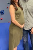 Bought this dress in size Medium for a baby shower (I'm 29 weeks pregnant). Pre-pregnancy I was ~125 lbs but currently 148 lbs. The cut is a bit low on the bust so I hemmed it up a bit. Very cute and comfortable but recommend spanx as you can easily see underwear lines without them. Overall I recommend! - Kayla B.