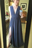 I bought this dress for my engagement pictures that I plan on taking in late summer/early fall. The dress is beautiful and the material is very slowly, soft, and breathable. I was nervous about the plunging neckline on myself, but I actually really like the way it looks and it isn't too revealing whatsoever. Thanks for a beautiful dress! - Celeste K.