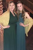 The rich, evergreen color of this dress is beautiful and I really like the concept of the high neckline combined with the simple, open back. The dress was very flowy and breathable, which made it easy to wear and dance in. I'd recommend this dress! (Dress is on the right in both of the pictures) - Celeste K.