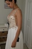 I wanted this dress for awhile for my wedding. It is so beautiful. The beadwork and feel of the dress makes it look like it's much more expensive than what you're paying. I wish they had a smaller size than 2, but it's okay I'll do alterations for it. My wedding is in December,  and I try on this dress every time I get a chance to. - Marlena