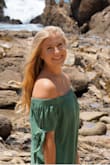 I would definitely recommend buying this dress! The color goes really nice with pretty much anything. It's very loose but fits well. I took my graduation pictures with this dress and I couldn't have picked a better one!! - Pam K.