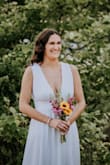 I was so happy with this dress! It was perfect for our elopement! I had a wedding dress already but since COVID-19 forced is to postpone, I wanted to keep that dress a surprise. This dress was so simple yet elegant. I got so many compliments on how beautiful it looked! (I sewed the sides slightly to help with the fit). - Brittany P.
