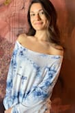 After 5-10 washes this top still has the same extreme softness as the first day I got it. It fits oversized, with bell like sleeves and personally comes off of my shoulder when I wear it. Honestly one of my favorites because its so soft and lightweight! - Cameron P.