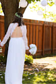 I had so many compliments on my dress! You would never know that I got it for under $100! I purchased this dress because we decided to elope due to all the restrictions in lieu of COVID-19, and it is GORGEOUS. It was REALLY long on me but I am 5'1, so prepare to get it altered if you're around this height. (I didn't have time due to quick decisions) everybody loved the lace sleeves and the backless form. I think if I had to order it again, I would size down to a XS, as the arms were a little loose as well as the bust area. It still fit pretty much perfectly though. Thank you LULUS. - Logan K.