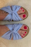 Love these sandals! I usually wear a size 6.5 or 7 depending on the shoe. After reading other reviews I ordered 7 and they fit great. They're very comfortable and the material is soft with a little bit of cushion. - Shayna S.