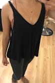 This tank is perfect! It's flowy but hangs just right and doesn't make me look boxy or like I'm drowning in it. I love the length of it too! - Carmy L.