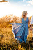 This dress was perfect! I wanted a beautiful blue dress that was flowy!!! I did have to make a small tack on each of the sides because I'm petite and I put a safety pin on the inside of the V so nothing would fall out, as I didn't wear a bra underneath. - Suzann B.