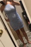 I bought this for a wedding I have coming up at the end of summer! It is a little tight but if I would have sized up or down, it wouldn't of worked! This is definitely something you'd have to wear a no show thong with or nothing at all because it does hug my hips some! I totally recommend I bought in white as well for my bridal shower!! - Danielle B.