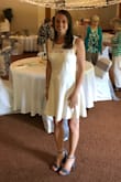 I wore this dress for my bridal shower and received many compliments! I ordered a small (what I usually wear) at first and while it did fit okay and I probably could have worn it, it was a little tight around the middle and I decided to size up to a medium just for my own comfort. Great dress! - Joanna S.