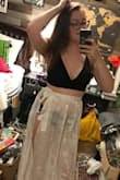 The skirt is super cute for a day at the beach. It is one size fits all so it basically fits, except that it doesn't close all the way so the slit is wider on me. I'd prefer if it didn't but it's still cute nonetheless. (don't mind the room, I'm moving) - Meghan H.