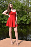I ordered this dress to wear for my graduation and I absolutely love it. Although it's a little short on me, mostly everything is and I wore shorts underneath and was just fine. The material is nice and thick, the color was bright and vibrant, and it fit perfectly! - Madeline G.