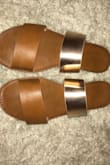 These sandals are perfect! I was worried that the straps were going to be too large and have leftover room between my feet but they fit like a glove! I ordered a size 7.5 (my normal size) in the brown/gold color. They fit true to size, are good quality, and the color is lovely! I would definitely recommend! Perfect for spring/summer and go with everything! (I've worn mine a lot over the past few weeks so the logo is slightly worn on the soul already in the photo) - Lauren B.