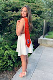 I wore this dress for graduation and it was perfect! I usually can't get away with not wearing a bra, but I didn't have to wear one with this dress! I love the back, and the flows skirt. I wasn't sure what size to order since I range from an XS to a S, but this dress fit me in an XS. - Christa H.