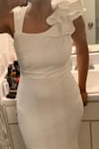 I'm usually a medium but my hips are technically a large so dresses always fit really tight down there. I went with a large and to be honest, it is somewhat loose on top but not noticeably so. I may not make any alterations at all, just wear a padded bra *wink*. The material quality is great, flowy, long (which was a huge relief to me). 
ps. I added the top and bottom half of my photo because it kept making me crop it. :-/ - Sharbacha E.