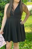 I loved this dress! I bought it to take graduation photos and it was perfect for it. Love the material, it feels high quality. I am normally a medium in shirts/pants, but I ordered a large in this and it fit great! The top was a little loose on me, but nothing to worry about as long as I adjusted it every so often, nothing a pin couldn't fix. - Alexis O.