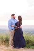 I wore this dress for my engagement photos. I loved the color and the wrap style to the dress. The only things that need some adjustments for me are the length which is pretty long and I'm 5'8" and it's a little too relieving on the top so I had to pin it. Other then that I love it and got many compliments! - Mikala